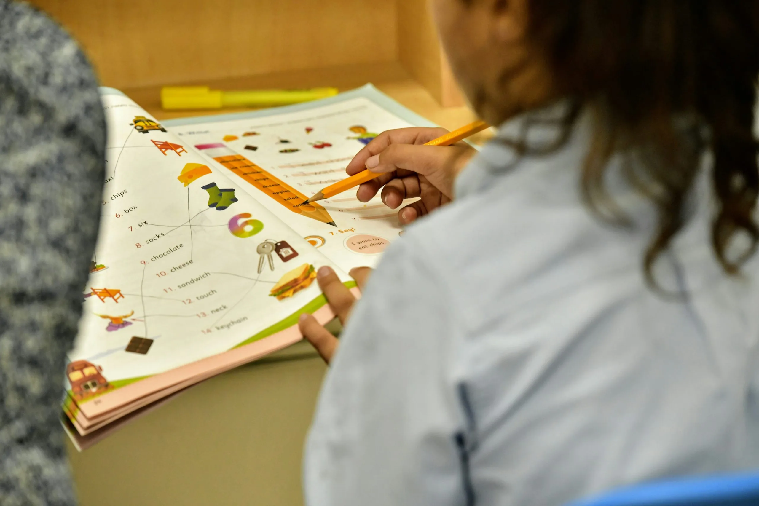 a student completes an educational worksheet created by a teather