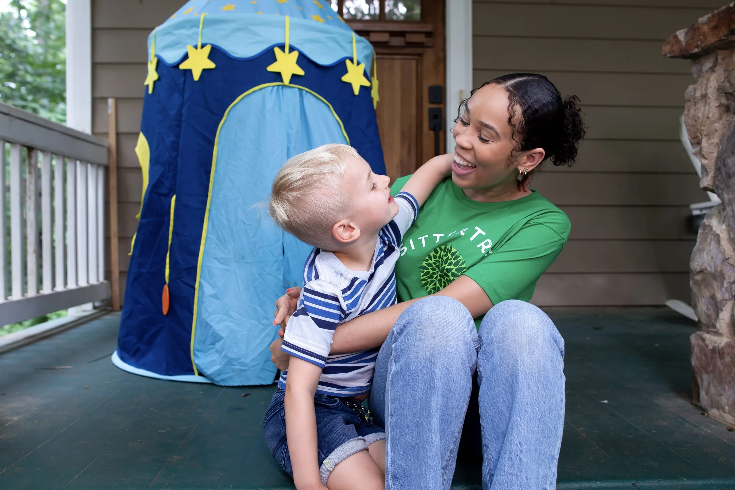 Sitter with child outside